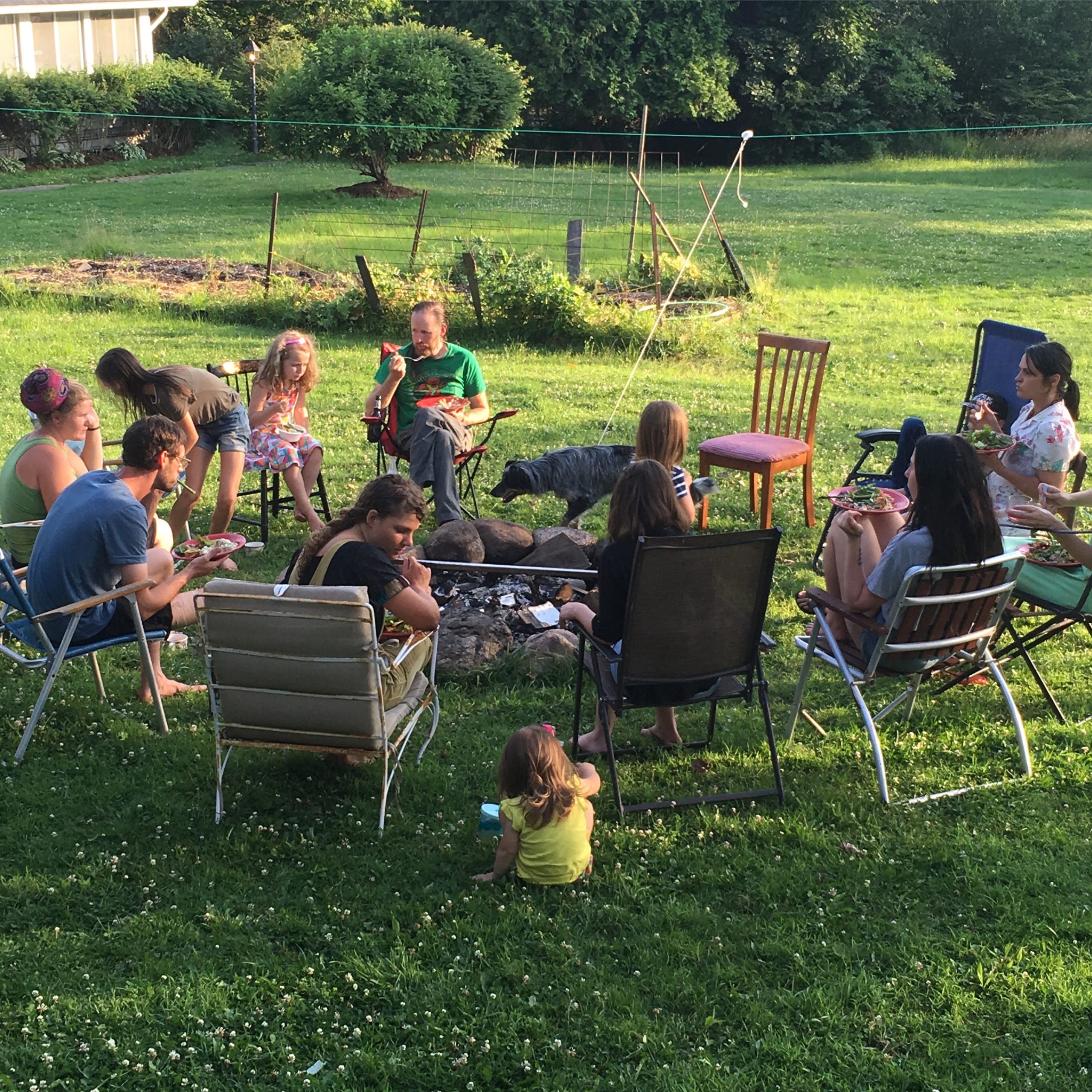 group gathering behind farmhouse